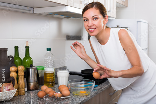 woman preparing omelet