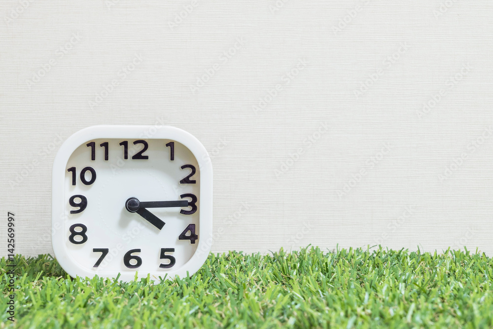Closeup white clock for decorate show a quarter past four o'clock or 4