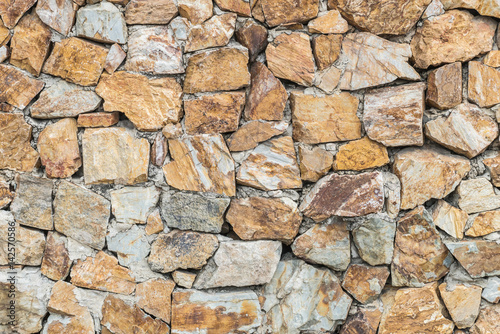 Closeup surface brick pattern at old stone brick wall textured background