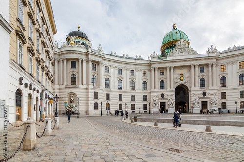 Cloudy panoramic view of Hofburg Palace at Michaelerplatz, Habsburg Empire landmark in Vienna, Austria.