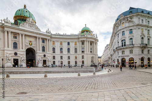 Cloudy panoramic view of Hofburg Palace at Michaelerplatz, Habsburg Empire landmark in Vienna, Austria. © Neonyn