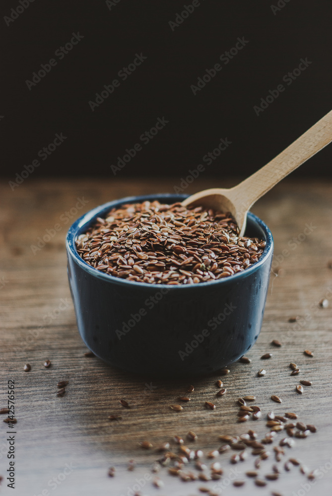 Bowl full of brown flaxseed or linseed. Cereals. Vitamins. Healthy food. Bowl full of brown flaxseed or linseed. Cereals. Vitamins. Healthy food.