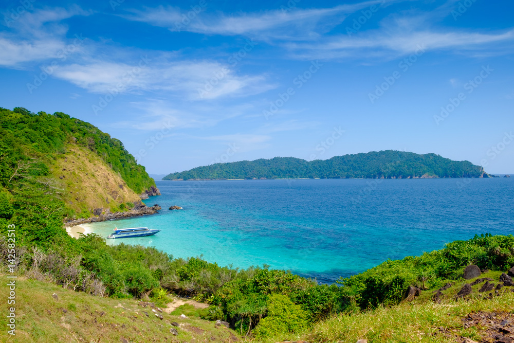 The ocean and mountains scenery with blue sky The ocean and mountains scenery with blue sky