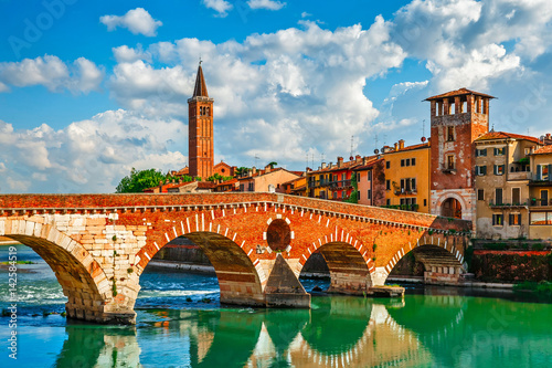 Panoramic view to Bridge Ponte Pietra in Verona on Adige river. photo