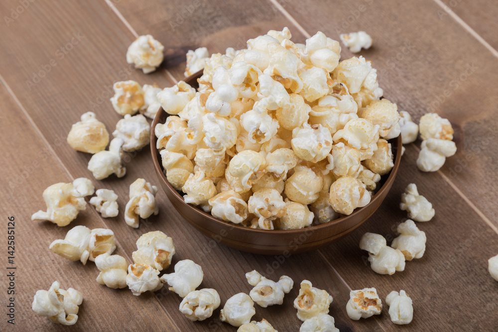popcorn bowl on wooden popcorn bowl on wooden
