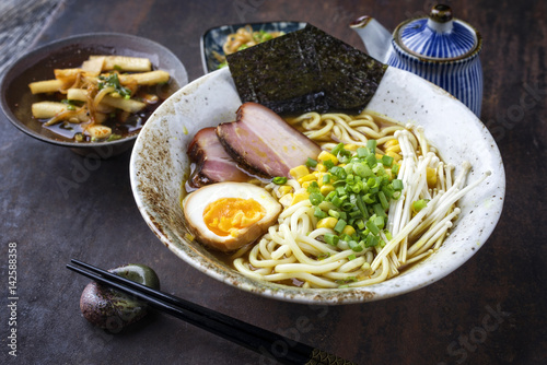 Fotografie Traditional Japanese Ramen Yakibuta with Enoki and Egg in a bowl