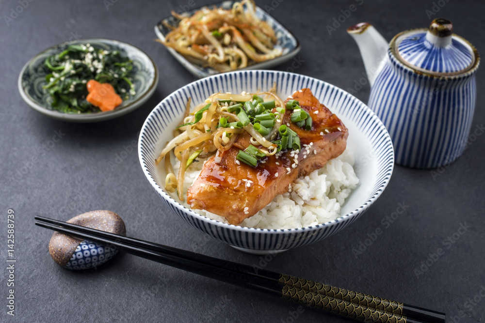 Traditional Japanese Salmon Teriyaki with Rice and Vegetable as close-up in a bowl Traditional Japanese Salmon Teriyaki with Rice and Vegetable as close-up in a bowl