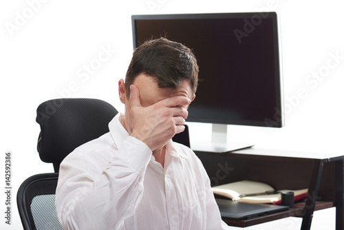 Man with headache in office