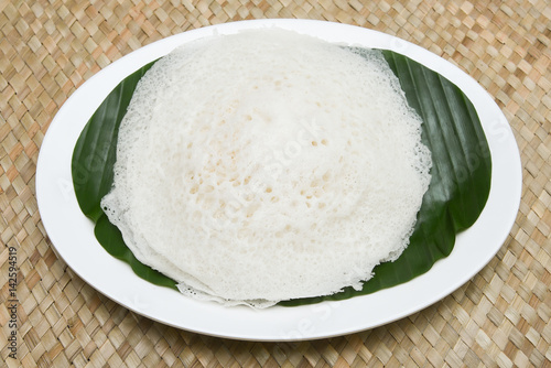 Appam / Palappam / Kallappam / vella appam / plain hoppers, popular traditional Kerala breakfast dish with hot spicy egg roast curry on houseboat, Alleppey, India. South Indian food. Sri lankan