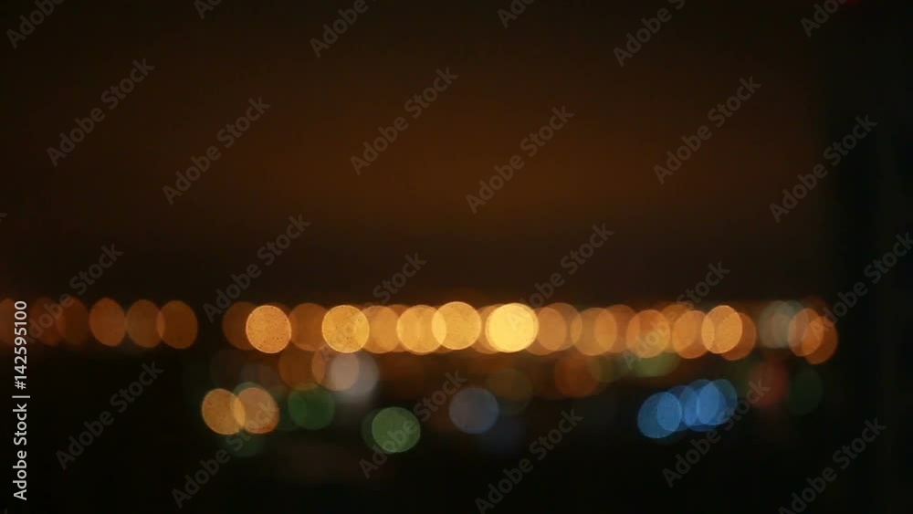 Orange and blue bokeh at night. Video full hd.