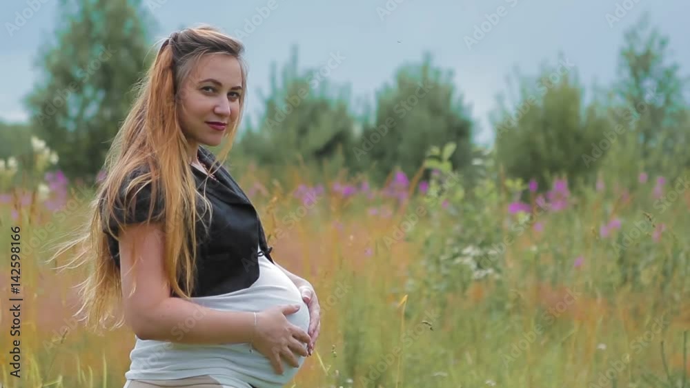 Pregnant Expectant Child Standing in Field