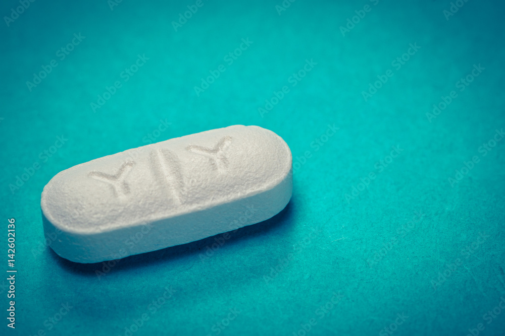 white pill on blue background white pill on blue background