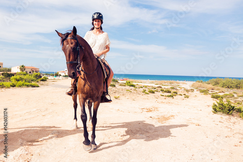 Young Woman Horseback Riding