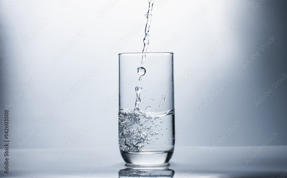 Drink water falling in glass,selective focus. Drink water falling in glass,selective focus.