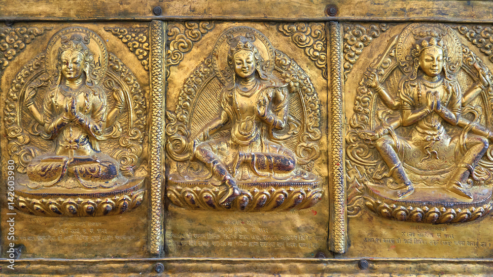 Golden carvings of Hindu Gods at Seto Machhendranath Temple in Kathmandu