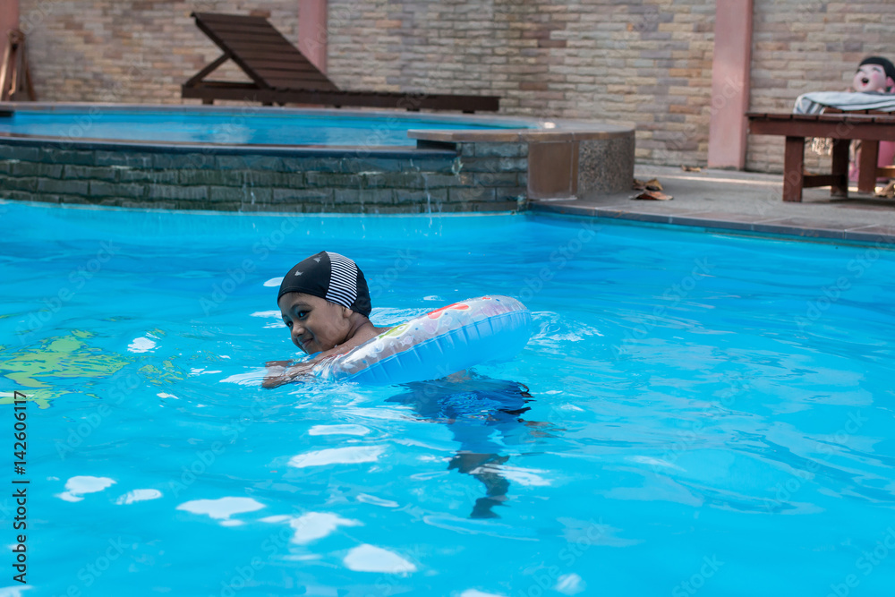 Fototapeta premium Cute little asian boy swimming pool