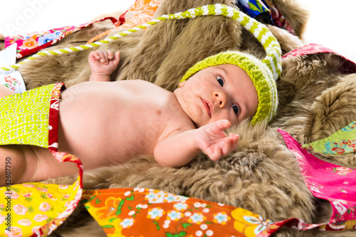 Cute newborn baby with a medieval cap