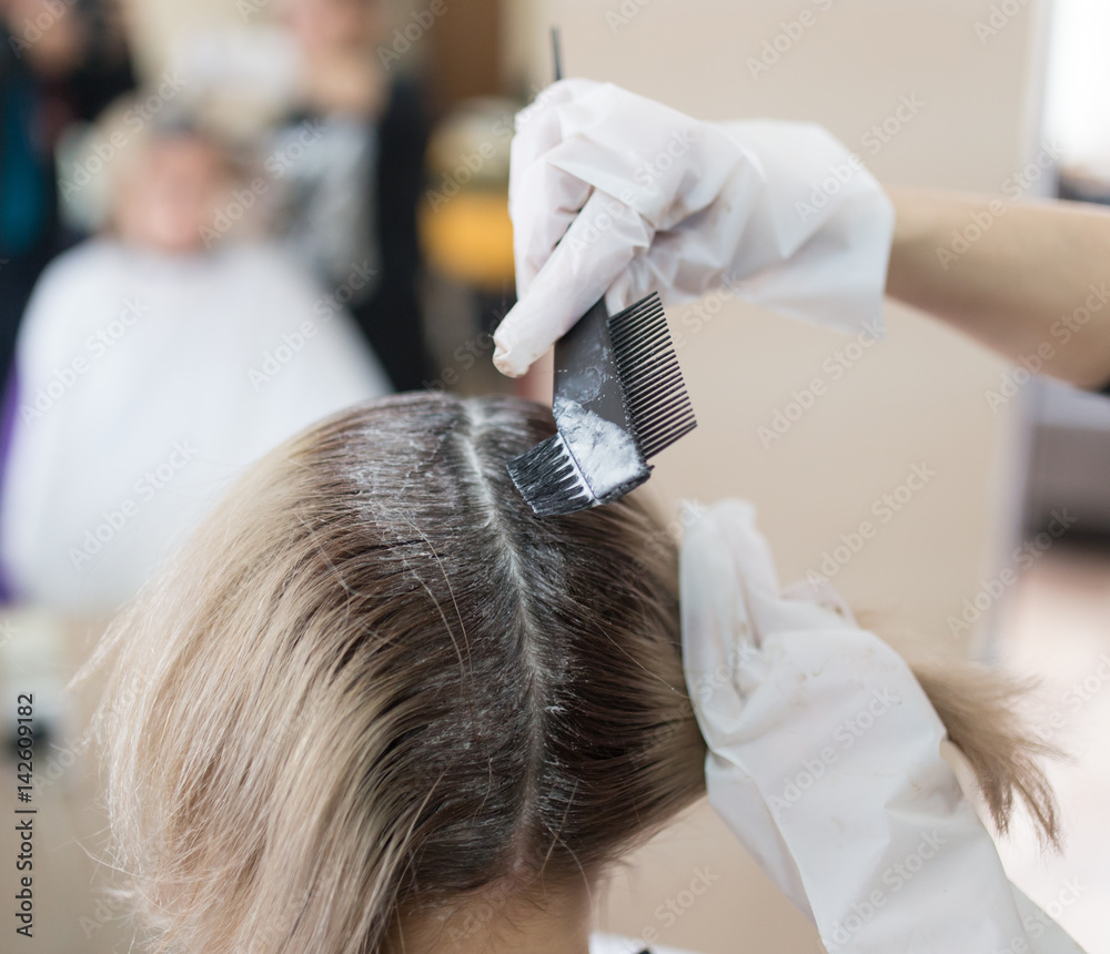 Hair coloring girl in the beauty salon Hair coloring girl in the beauty salon