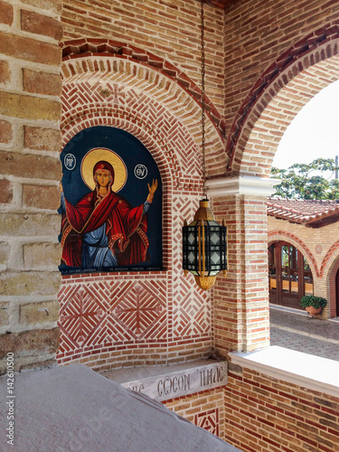 Ornated bricklaying wall with Our Lady icon. St. Ephrem the Syrian monastery in Kondariotissa.