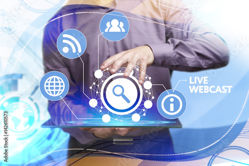 Business, Technology, Internet and network concept. Young businessman working on a virtual screen of the future and sees the inscription: Live webcast