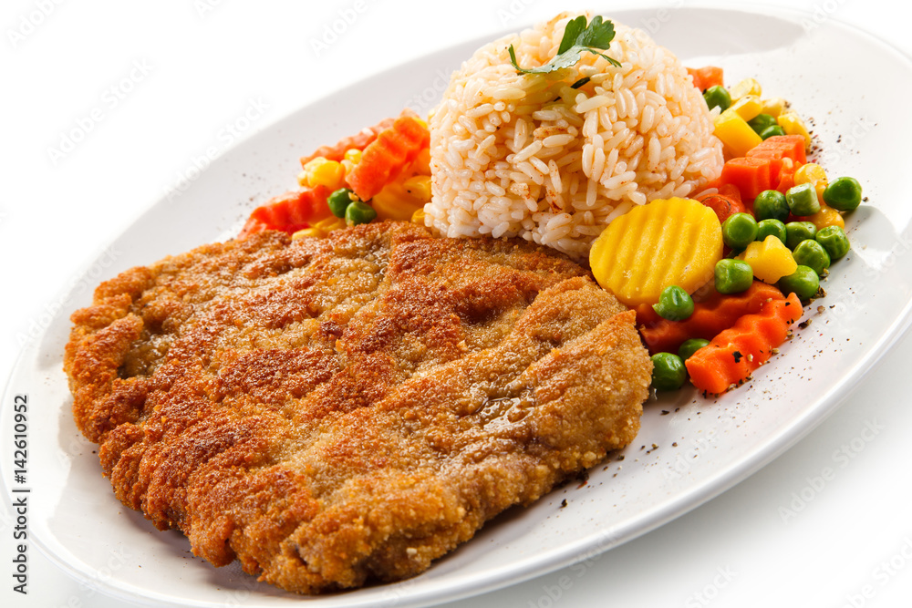 Fried pork chop with rice and vegetables