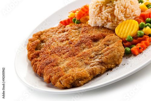 Fried pork chop with rice and vegetables