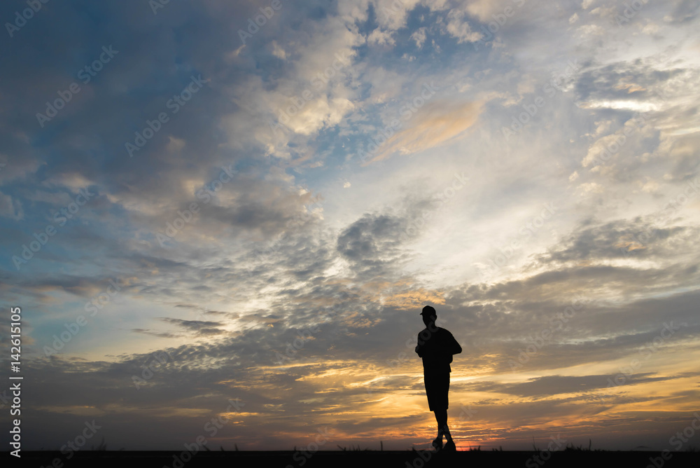 Silhouette of a man happy walking at sunset. Silhouette of a man happy walking at sunset.