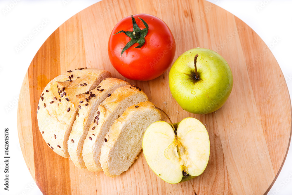 white bread with beans, tomato, Apple on a wooden tray white bread with beans, tomato, Apple on a wooden tray