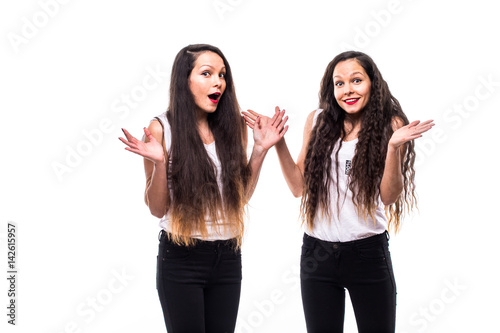 Beauty portrait of twins sisters missunderstand. photo