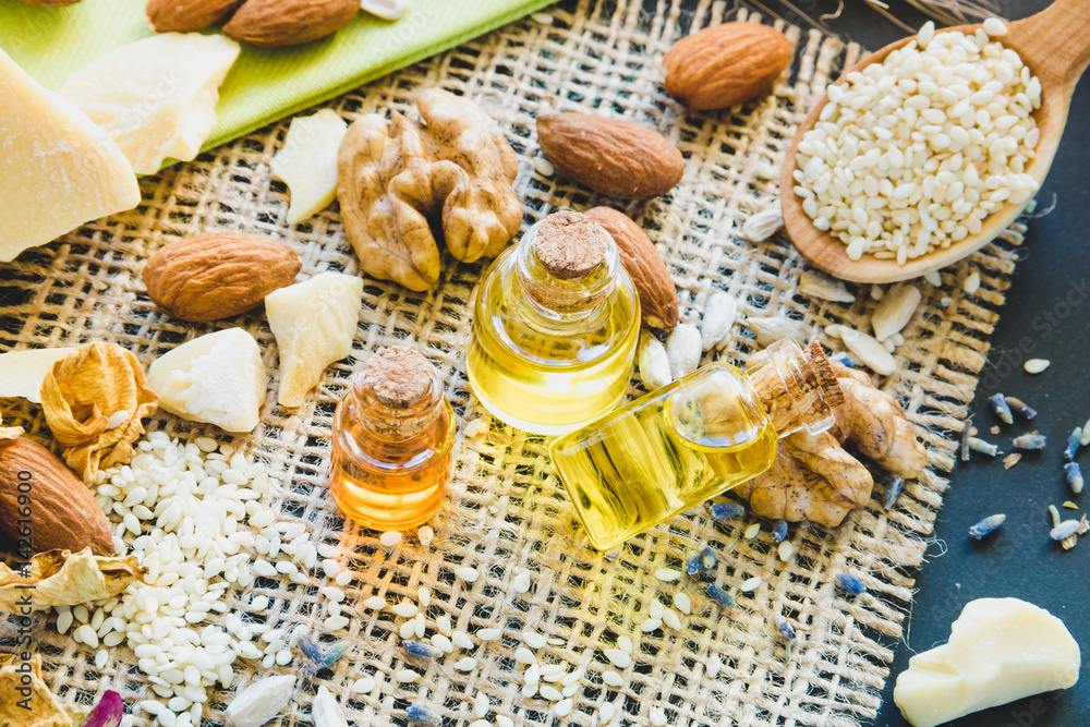 Cosmetic and medical oil of walnuts, almonds, cocoa butter close-up