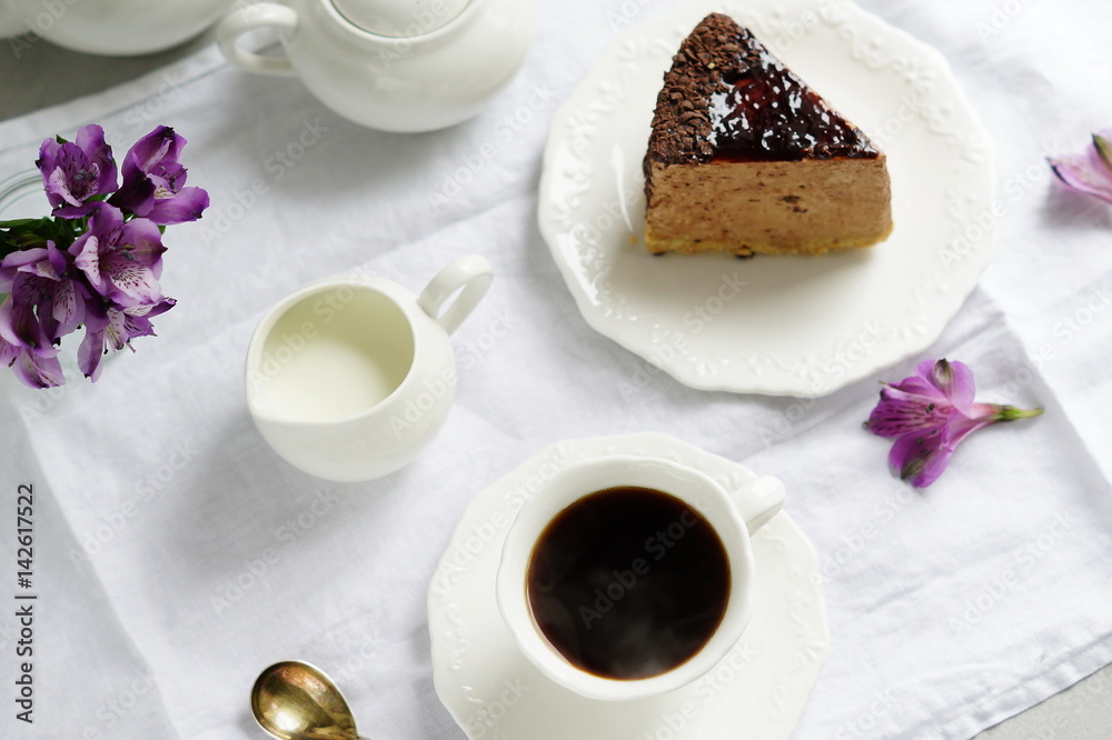 Coffee with milk and cake on a white background.top view.Holiday. Mother's day. Coffee with milk and cake on a white background.top view.Holiday. Mother's day.