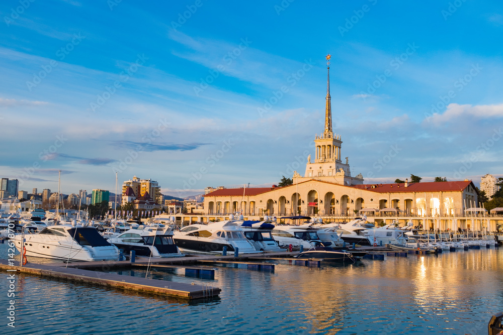 Seaport  with mooring boats at sunset in Sochi, Russia.