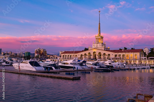 Seaport with mooring boats at sunset in Sochi, Russia.