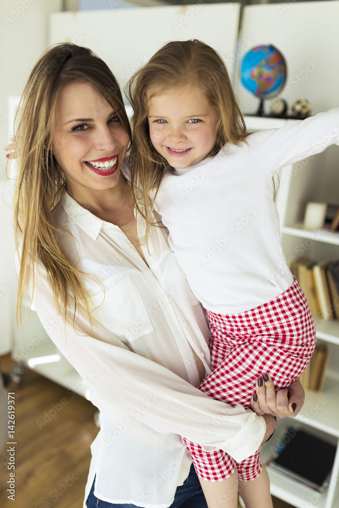 Mother with her daughter having fun at home. Mother with her daughter having fun at home.