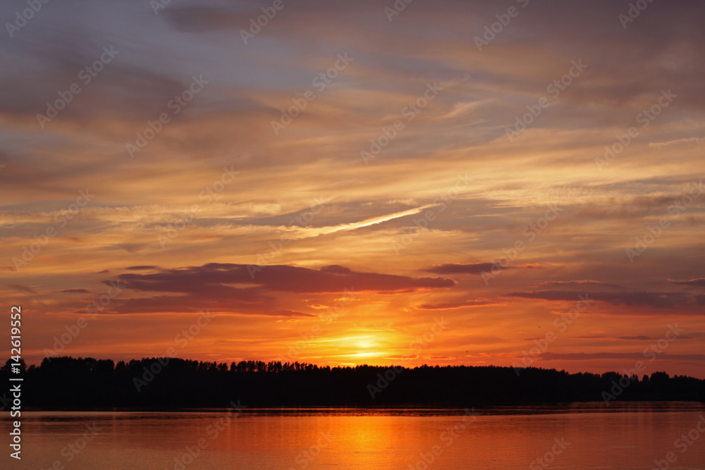Sensual colorful sunset on the lake