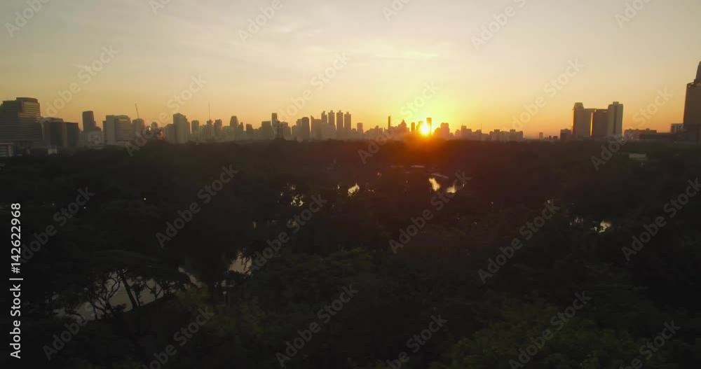 Sunrise Over Lumpini Park In Bangkok, Thailand, Ascending Aerial Shot
Sunrise Over Lumpini Park In Bangkok, Thailand, Ascending Aerial Shot