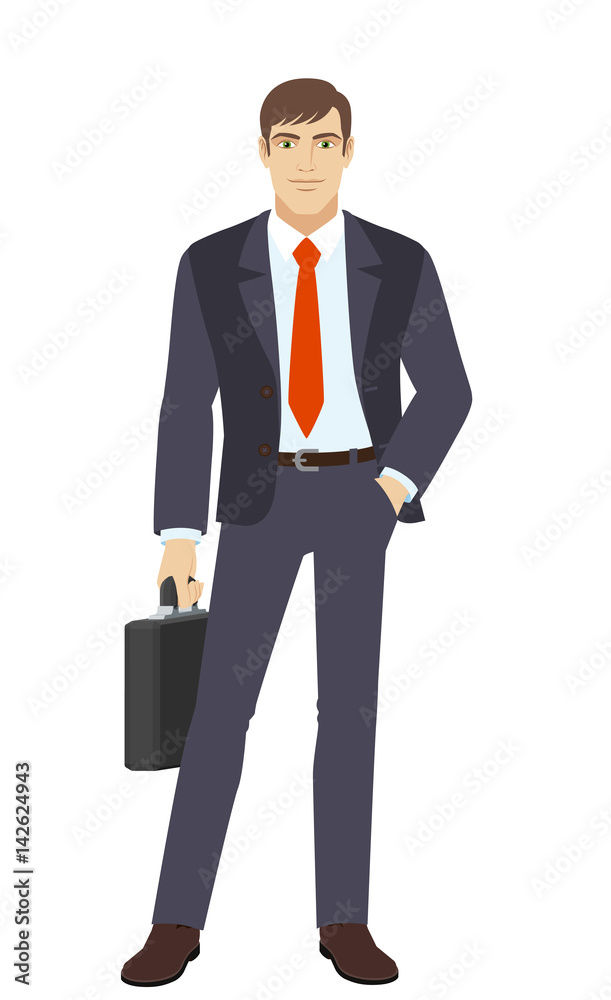 Businessman with briefcase standing with hand in pocket Businessman with briefcase standing with hand in pocket