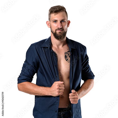 Tough looking man with beard and tattoo isolated on white