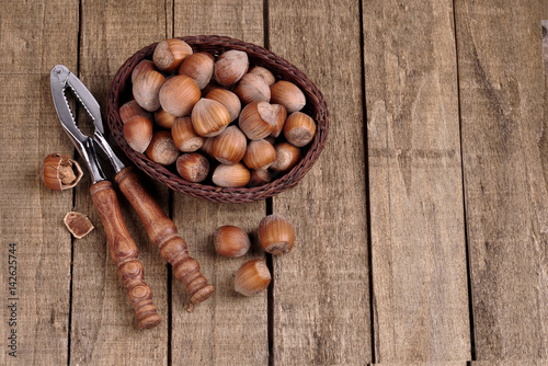Different types of nuts on wooden background