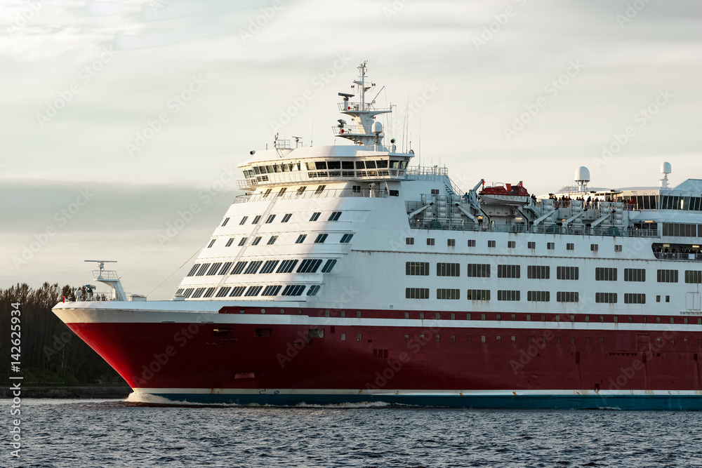 Red cruise liner's bow. Passenger ferry underway