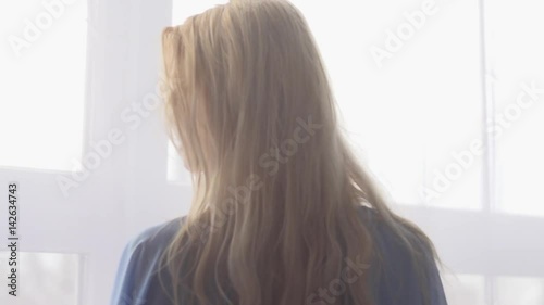 Pretty Young Woman in the seductive dressing gown. SLOW MOTION Stock Footage. Model: Eveline. 