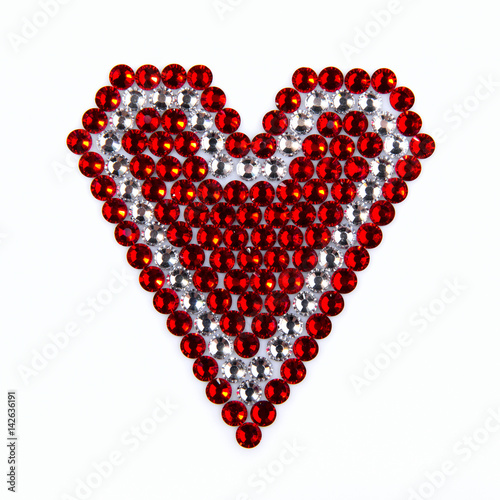 Precious Sparkling Rhinestones Red and Crystal Colors, Folded Heart Shaped, on a White Background.