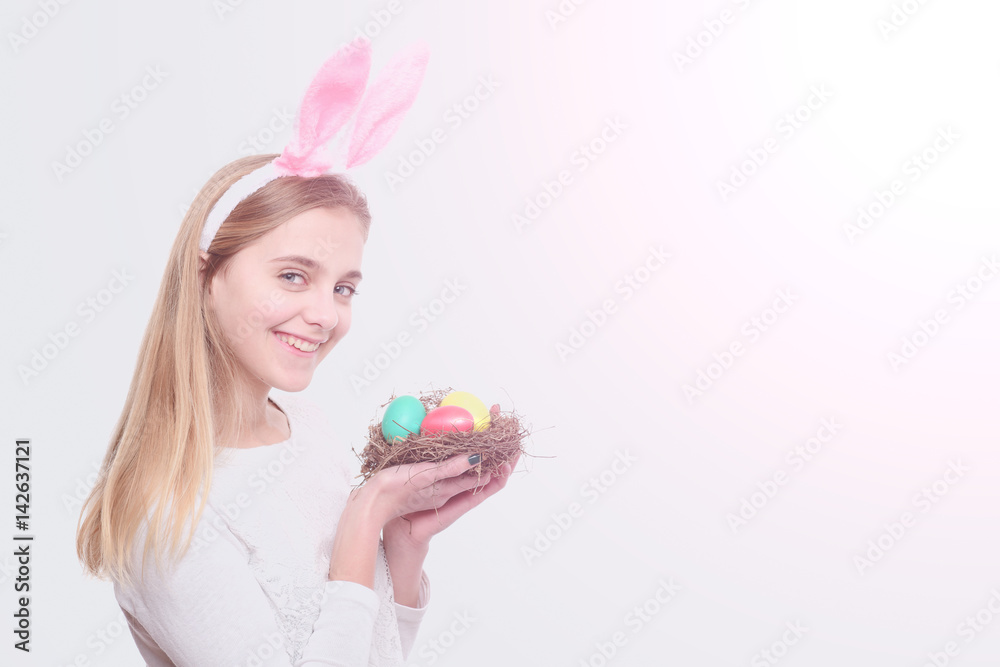 happy easter girl in bunny ears with colorful painted eggs happy easter girl in bunny ears with colorful painted eggs