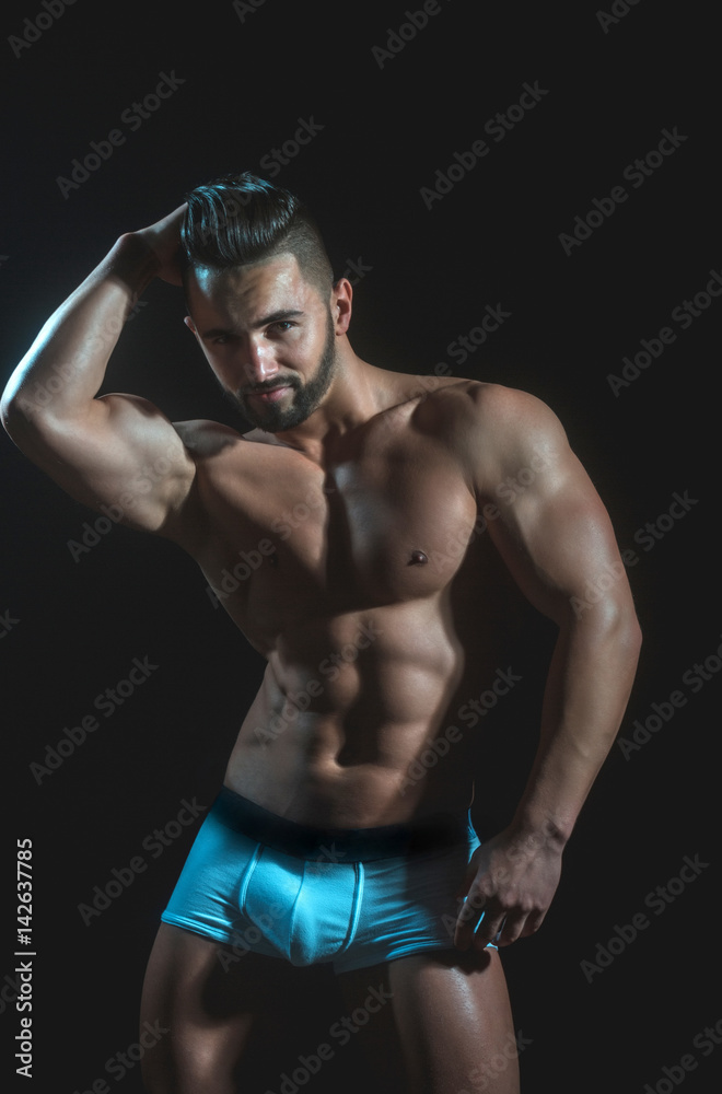 handsome muscular macho man with sexy athlete body in pants Stock Photo |  Adobe Stock