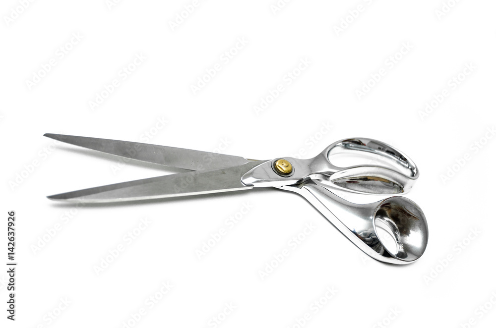Pair of tailor scissors with metal golden handle isolated on white background. Pair of tailor scissors with metal golden handle isolated on white background.