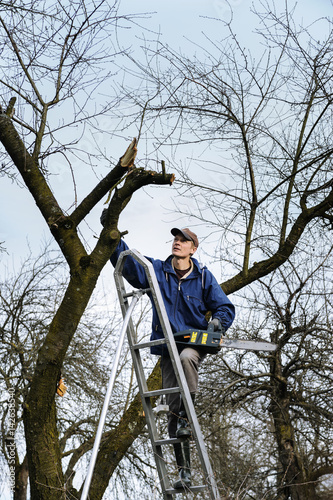  Man is raising up by a stepladder.