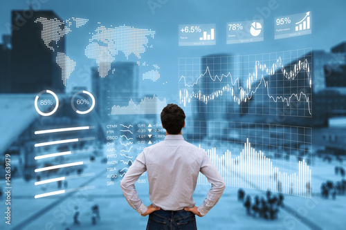 Person analyzing financial dashboard with KPI and business district background photo