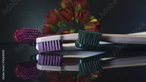   Tooth brushes close up isolated on the darck background.