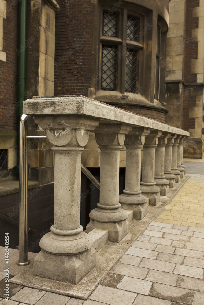 Fototapeta premium Stone staircase with balusters near old church