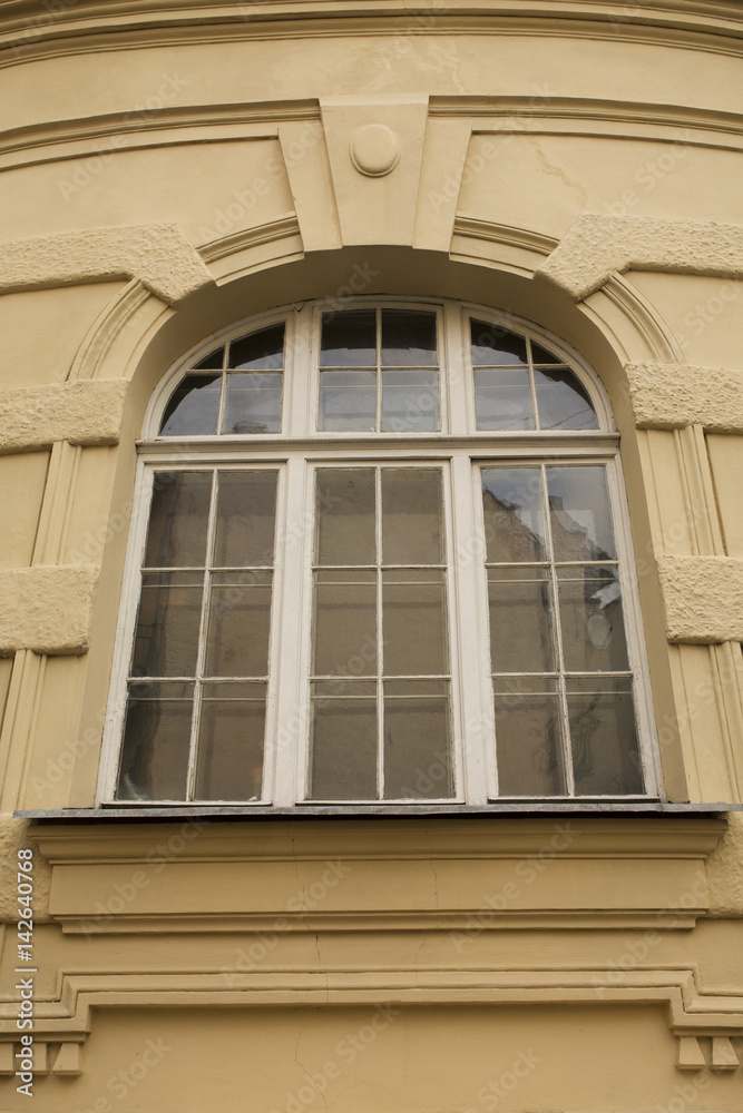 Big old window with arch in Lviv